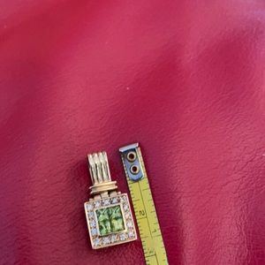 Peridot and diamond pendant in 14k gold